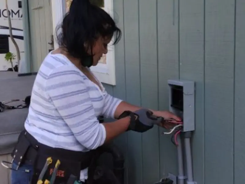 Licensed electrician wiring an exterior subpanel in Canal Fulton